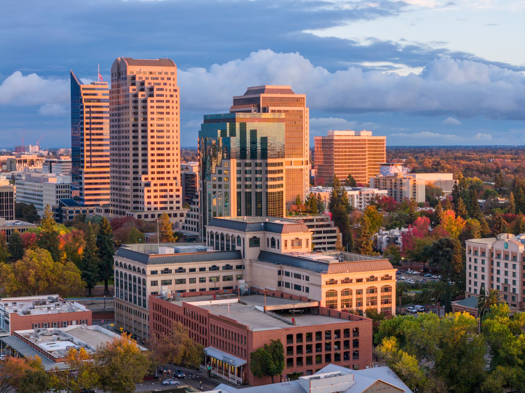 A stunning view of downtown Sacramento's skyline bathed in warm sunset light.