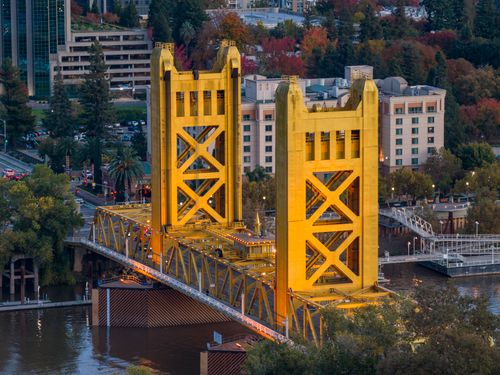Free A stunning aerial view of the iconic Tower Bridge with vibrant fall colors in Sacramento, California. Stock Photo