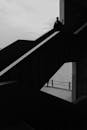 Silhouette on Modern Staircase Overlooking Sea