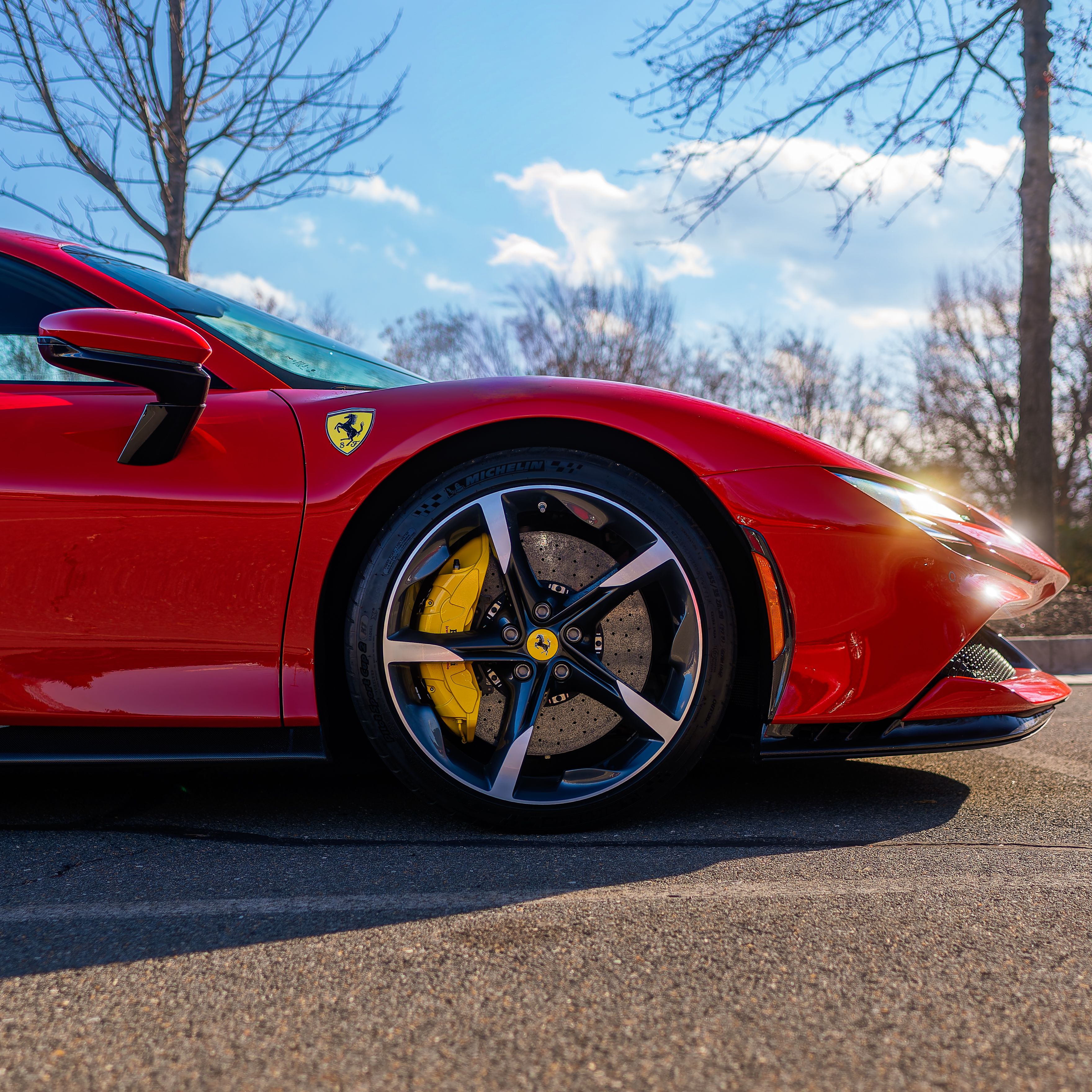 Vibrant Red Sports Car with Alloy Wheel and Caliper · Free Stock Photo