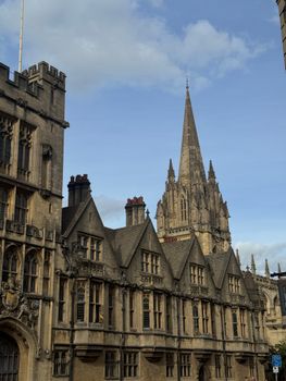 Exquisite Gothic architecture of Oxford University buildings under a clear sky.