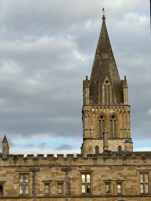 Free Vintage stone cathedral spire under overcast sky, showcasing Gothic architecture. Stock Photo