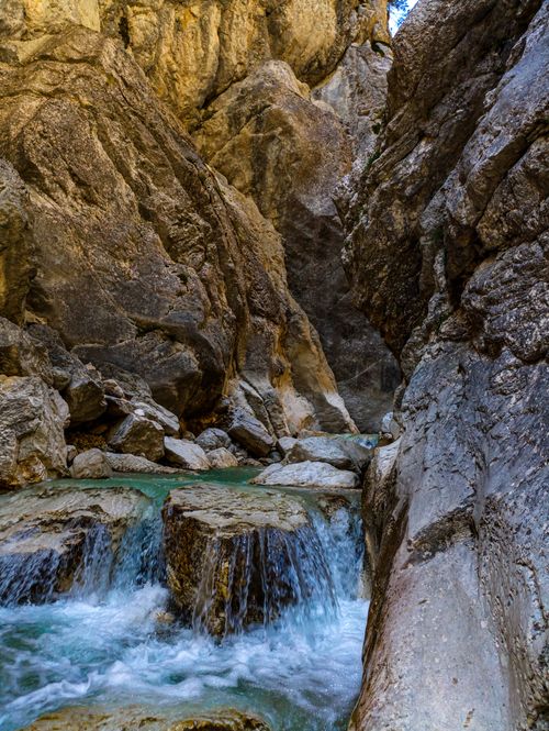 Free Picturesque waterfall flowing through rugged rocks in Veneto, Italy, showcasing natural beauty. Stock Photo