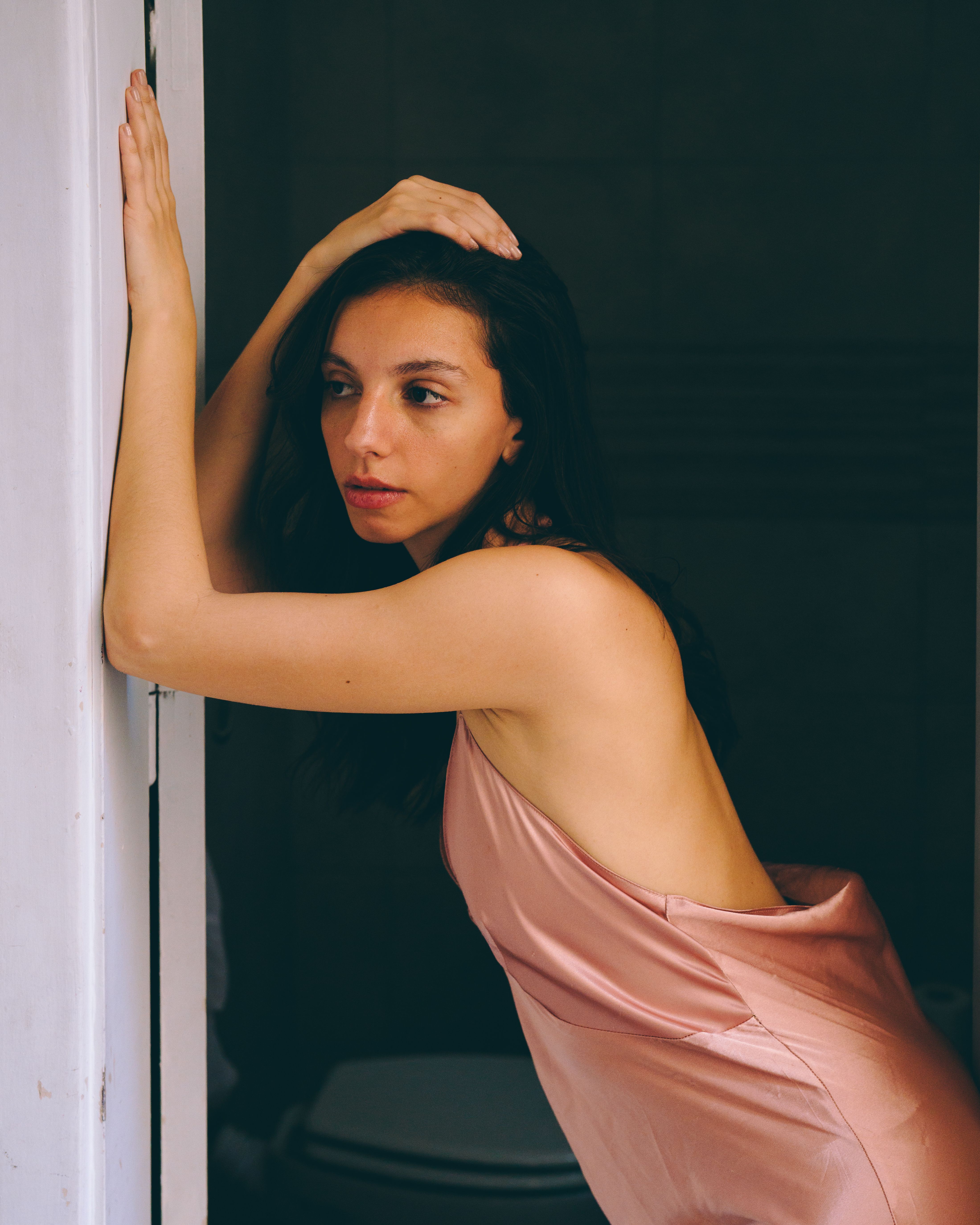 Elegant Woman in Silk Dress Posing Indoors · Free Stock Photo
