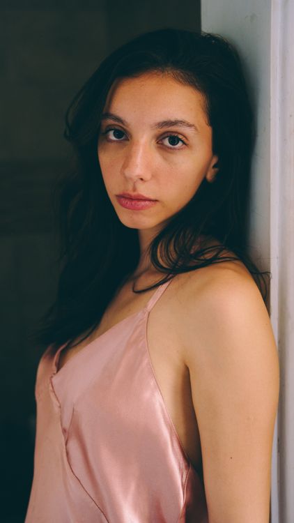 Elegant Woman in a Pink Dress Indoors · Free Stock Photo