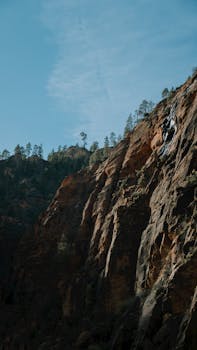 A breathtaking view of Utah's rugged red rock canyon landscape under a clear blue sky.