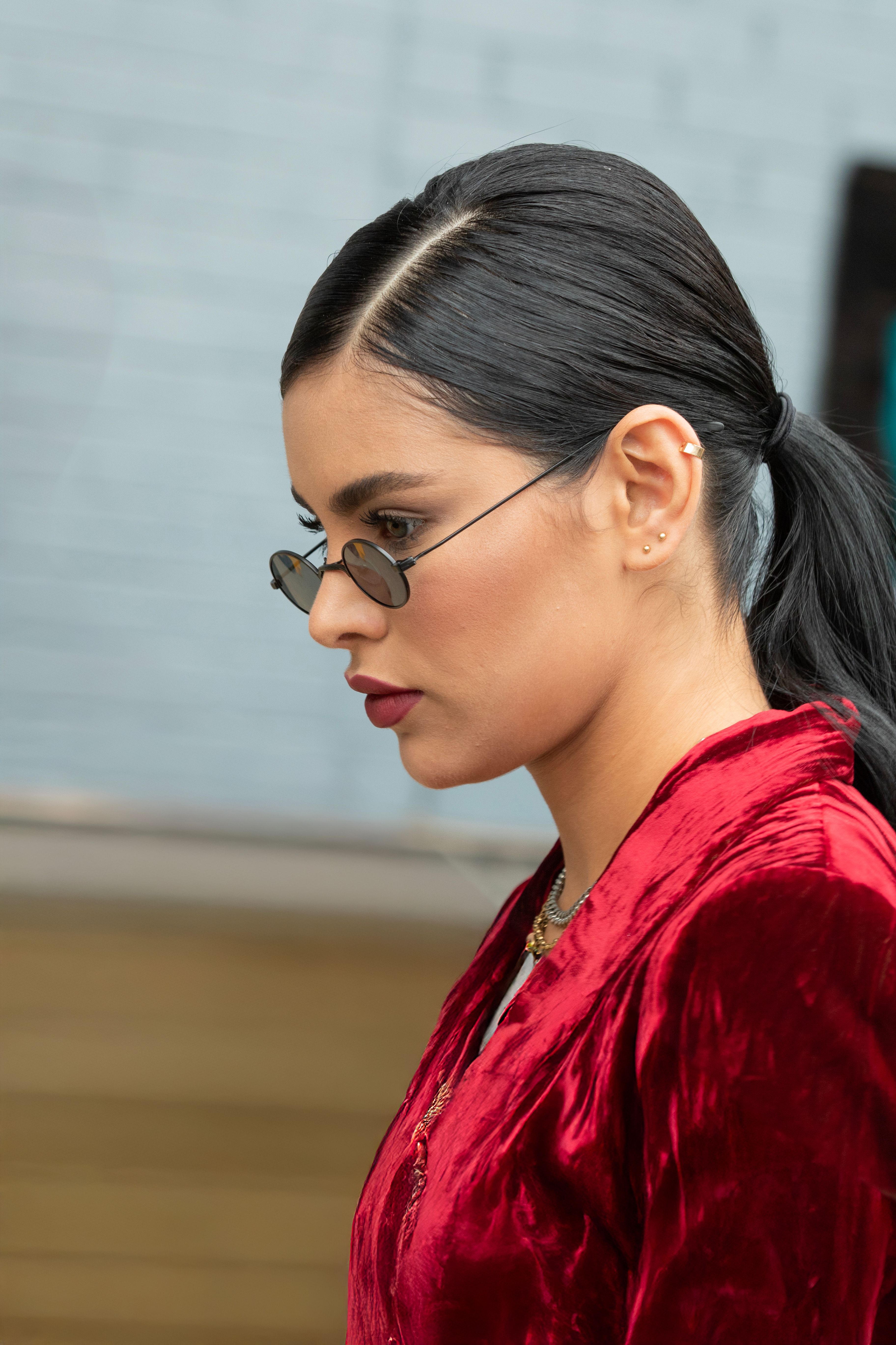 Elegant Woman in Red Velvet Outfit Outdoors · Free Stock Photo