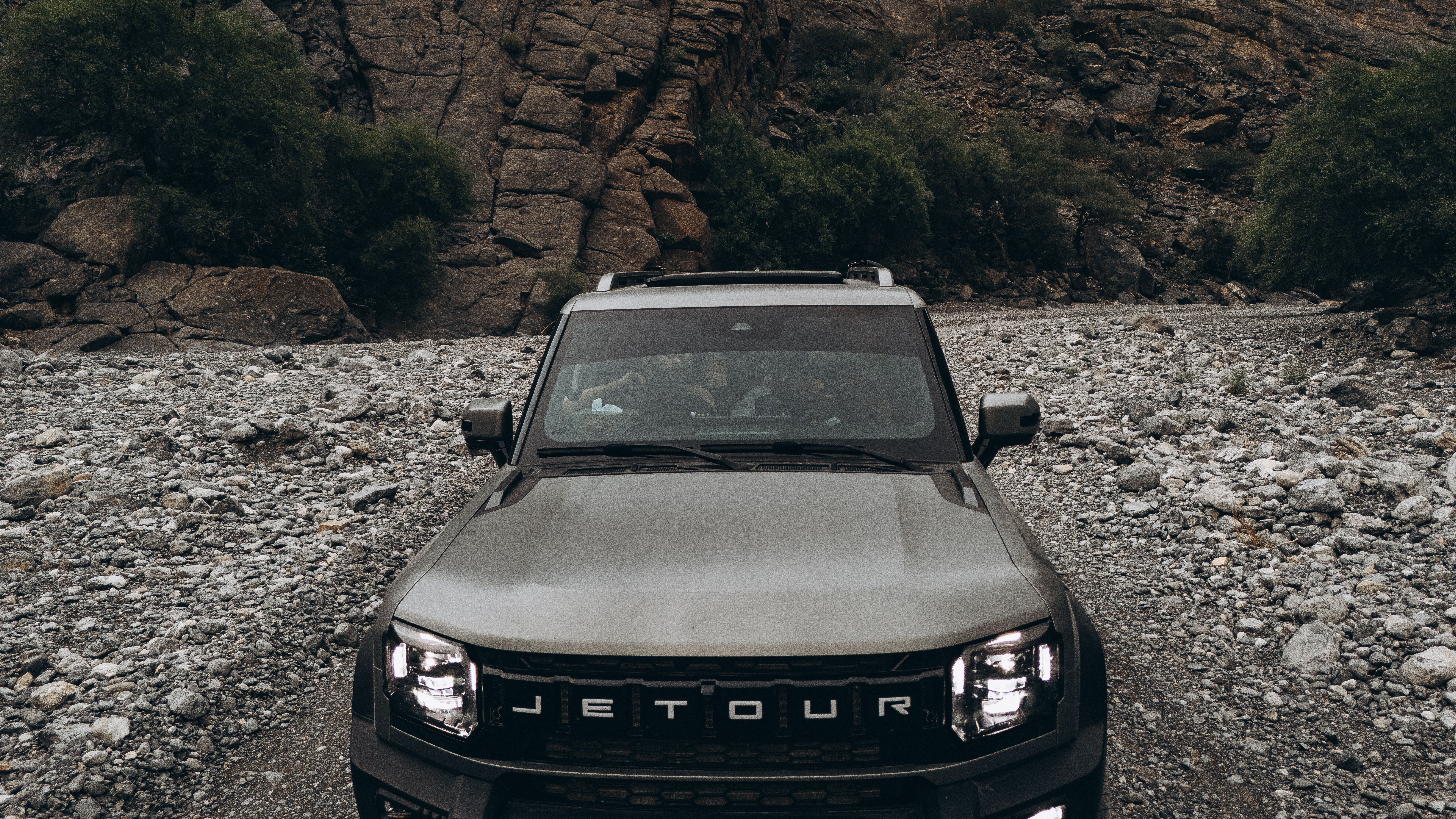 Explore rugged Omani landscapes with a powerful Jetour vehicle, perfect for off-road adventures.