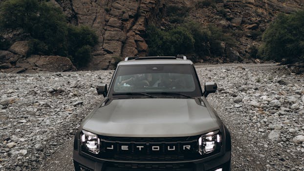 Explore rugged Omani landscapes with a powerful Jetour vehicle, perfect for off-road adventures.