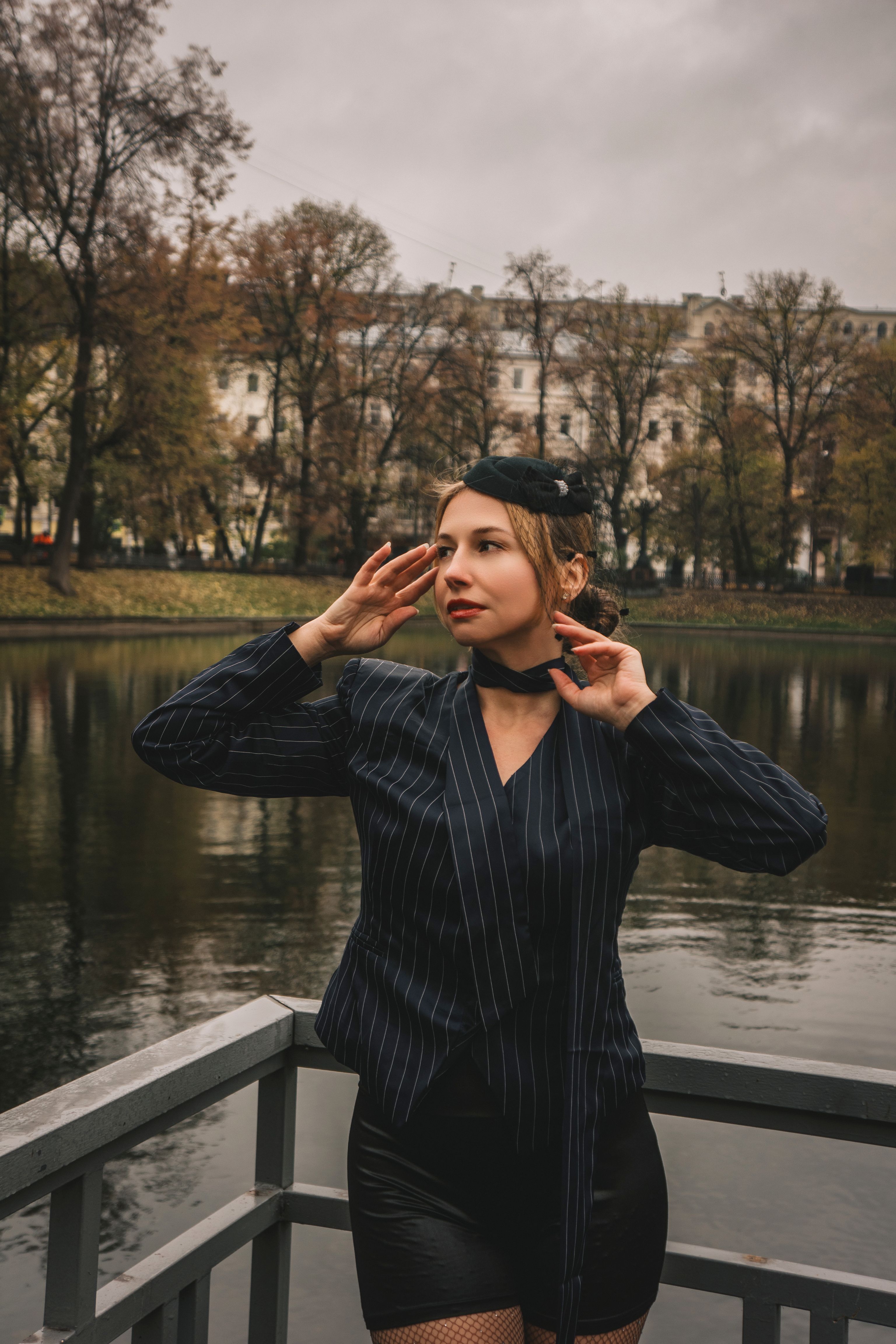 Stylish Woman Posing by Tranquil Park Lake · Free Stock Photo