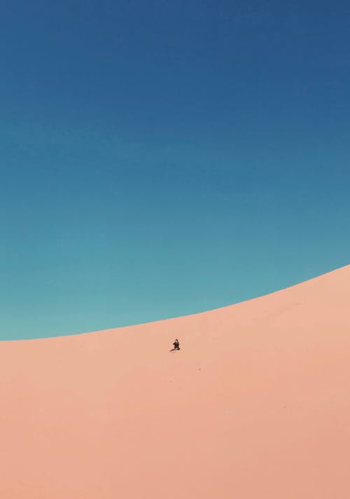 Free Person At A Desert Under Blue Sky Stock Photo
