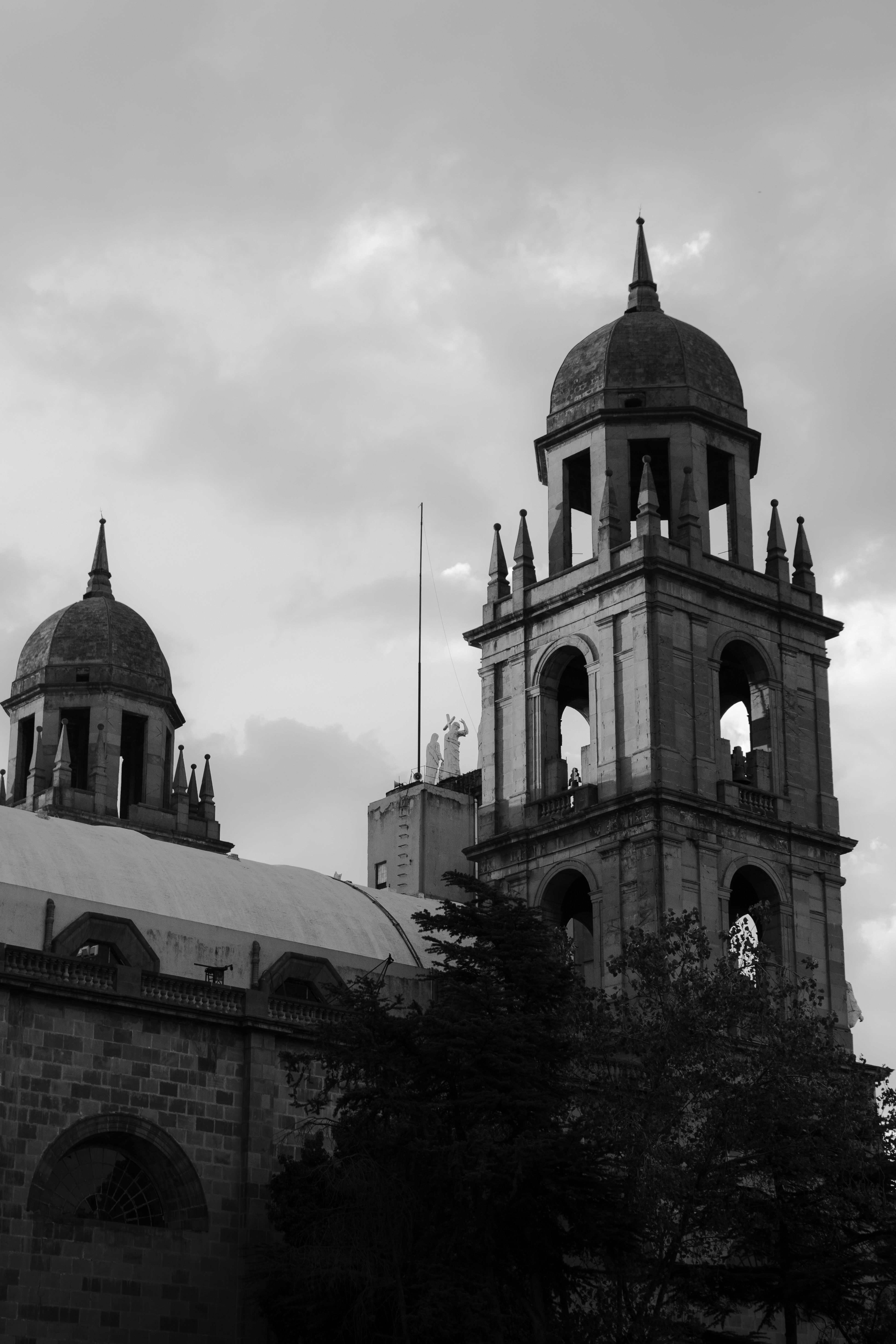 Historic Church Bell Tower under Clouded Sky · Free Stock Photo