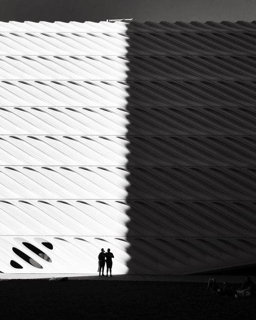 Abstract view of a geometric building silhouette against contrasting light and shadow in Los Angeles.