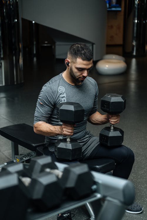 Free Man Sitting on Flat Bench Stock Photo