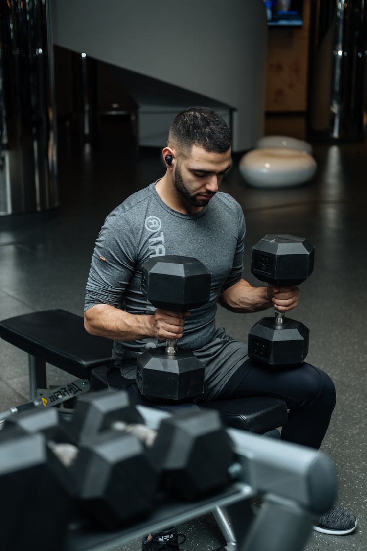 Man Sitting On Flat Bench