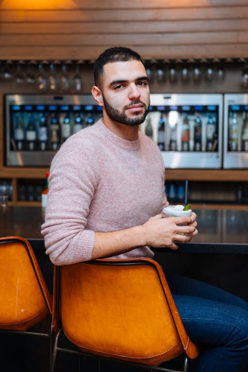 Man Sitting on Stool