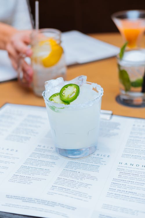 Free Glass of Tequila on Top of a Menu Stock Photo