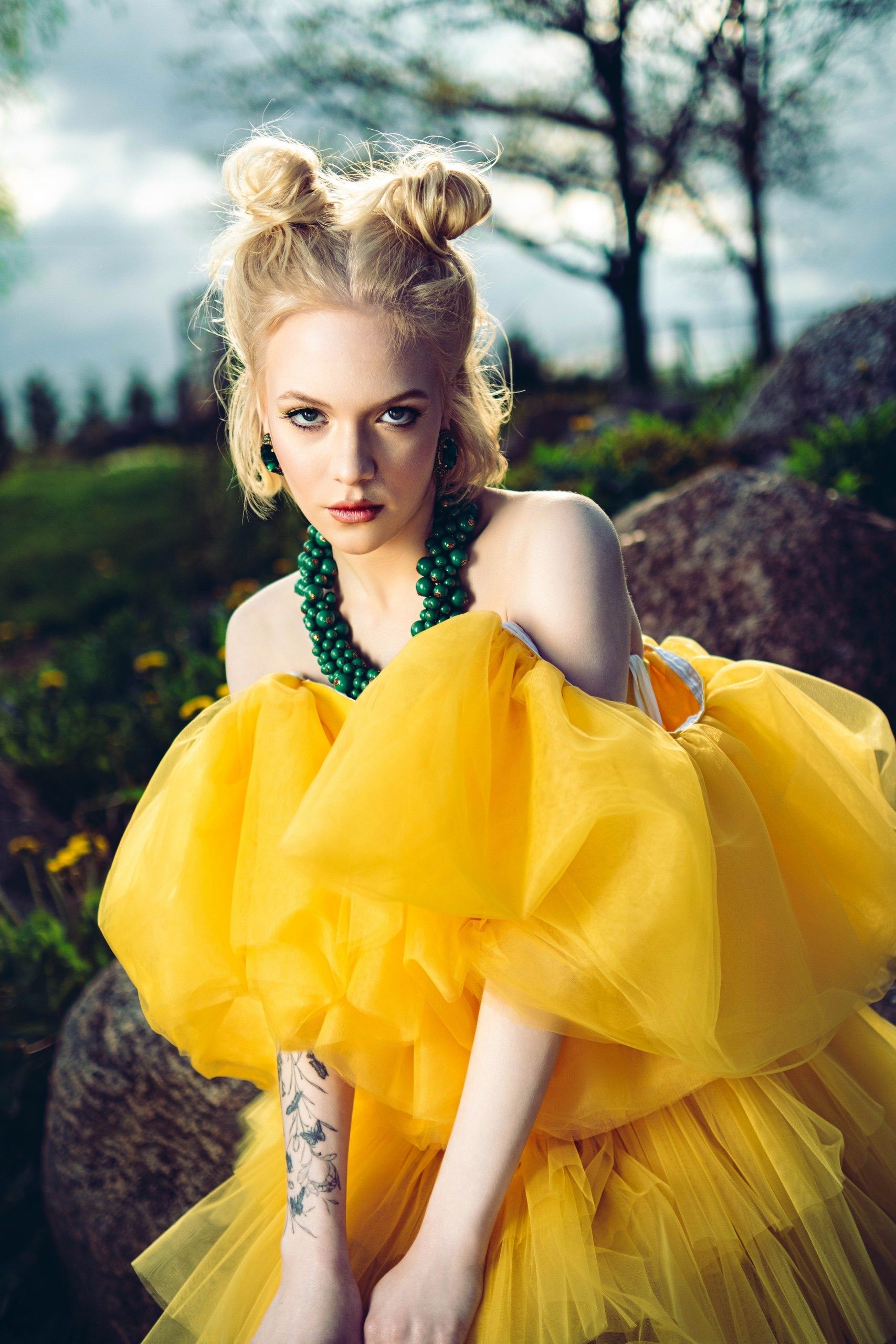 Fashion Model in Bold Yellow Gown Outdoors  Free Stock Photo