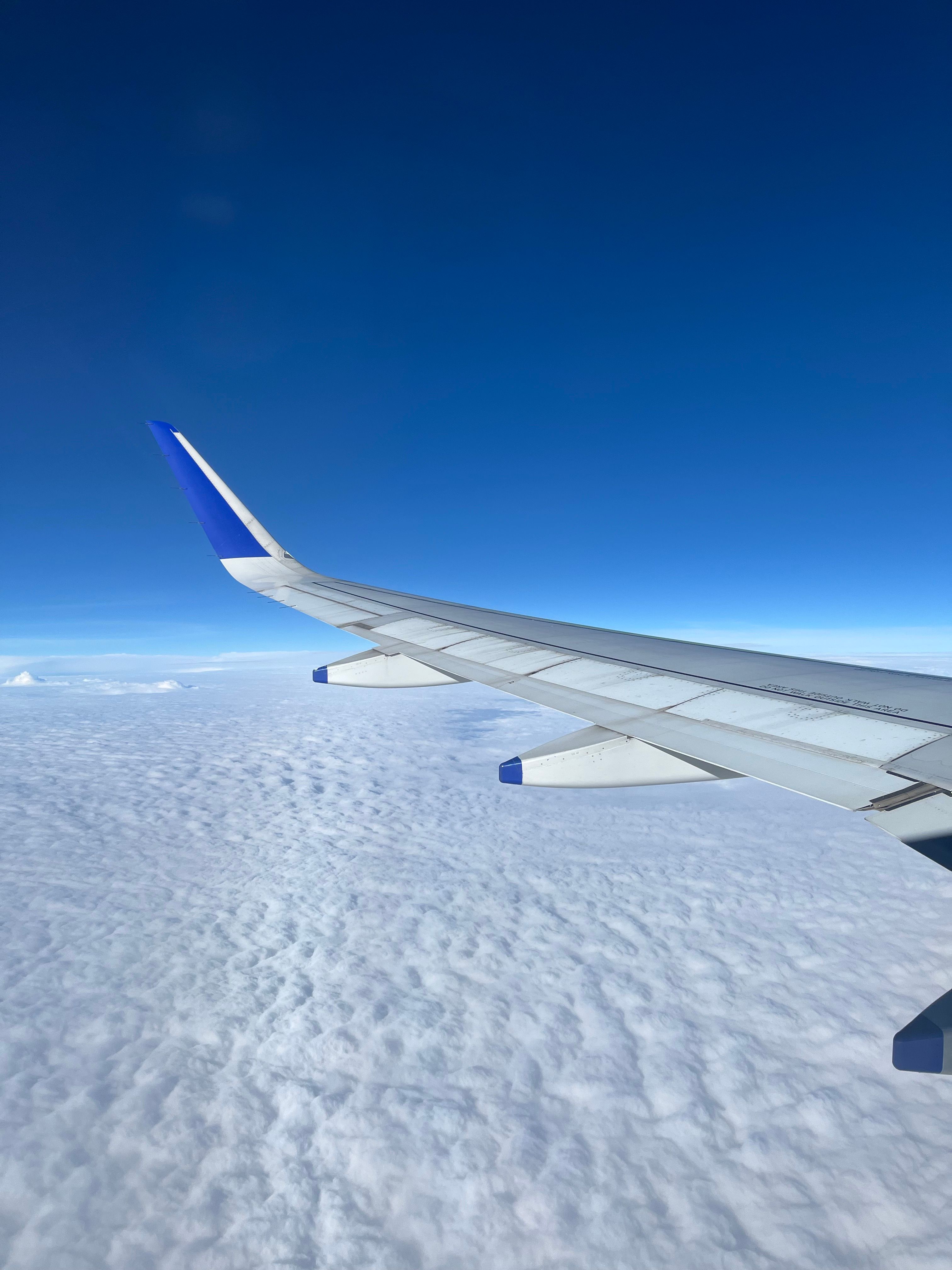 Scenic Aerial View from Aircraft Over Clouds · Free Stock Photo