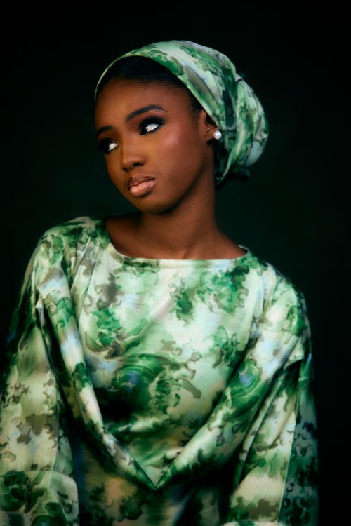 Elegant Woman in Floral Attire with Headscarf · Free Stock Photo