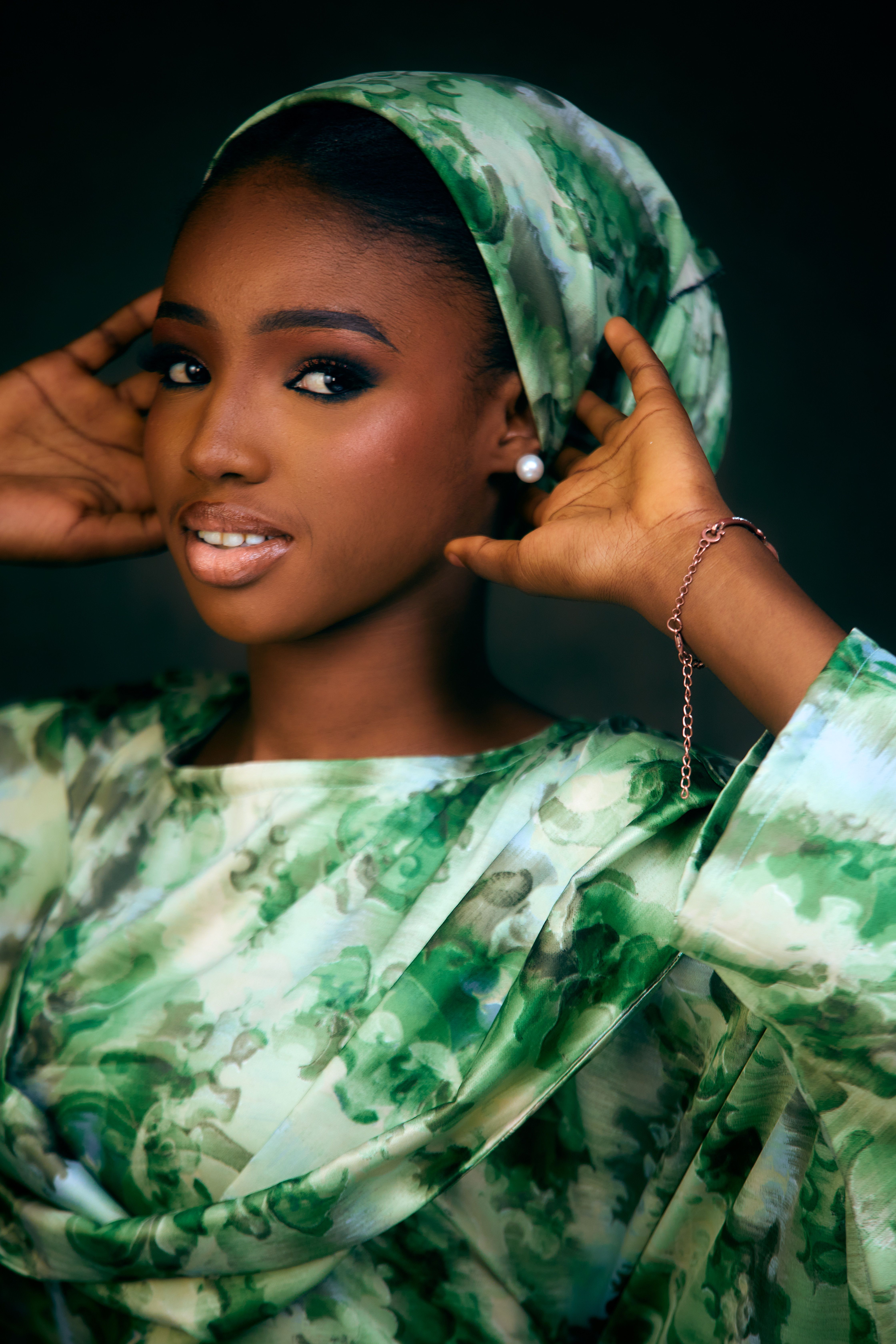 Elegant Woman in Green Floral Hijab Portrait · Free Stock Photo
