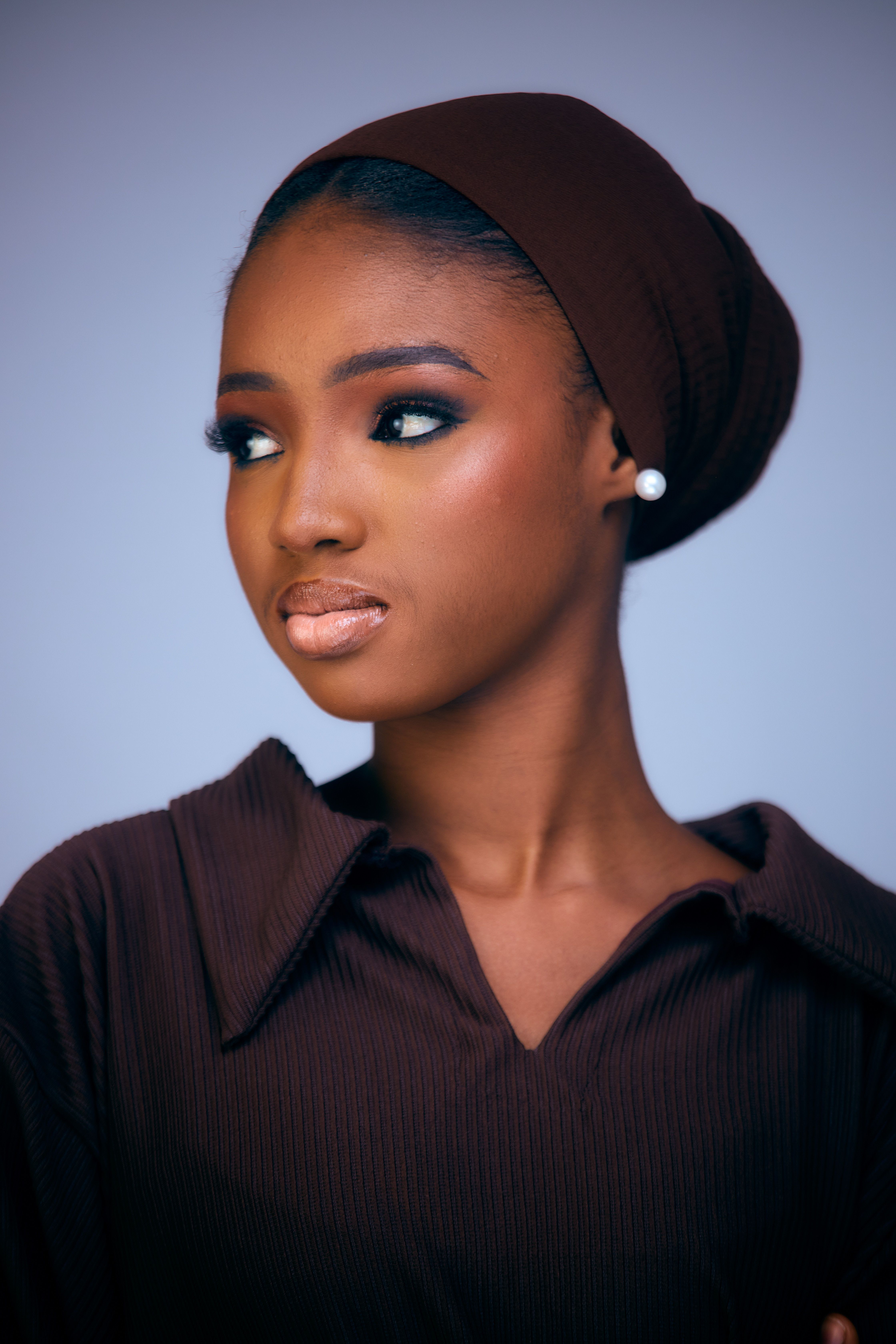 Elegant Portrait of a Woman in Brown Hijab · Free Stock Photo