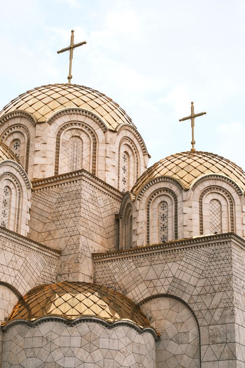 Free Detailed view of ornate golden domes on Orthodox church exterior. Stock Photo