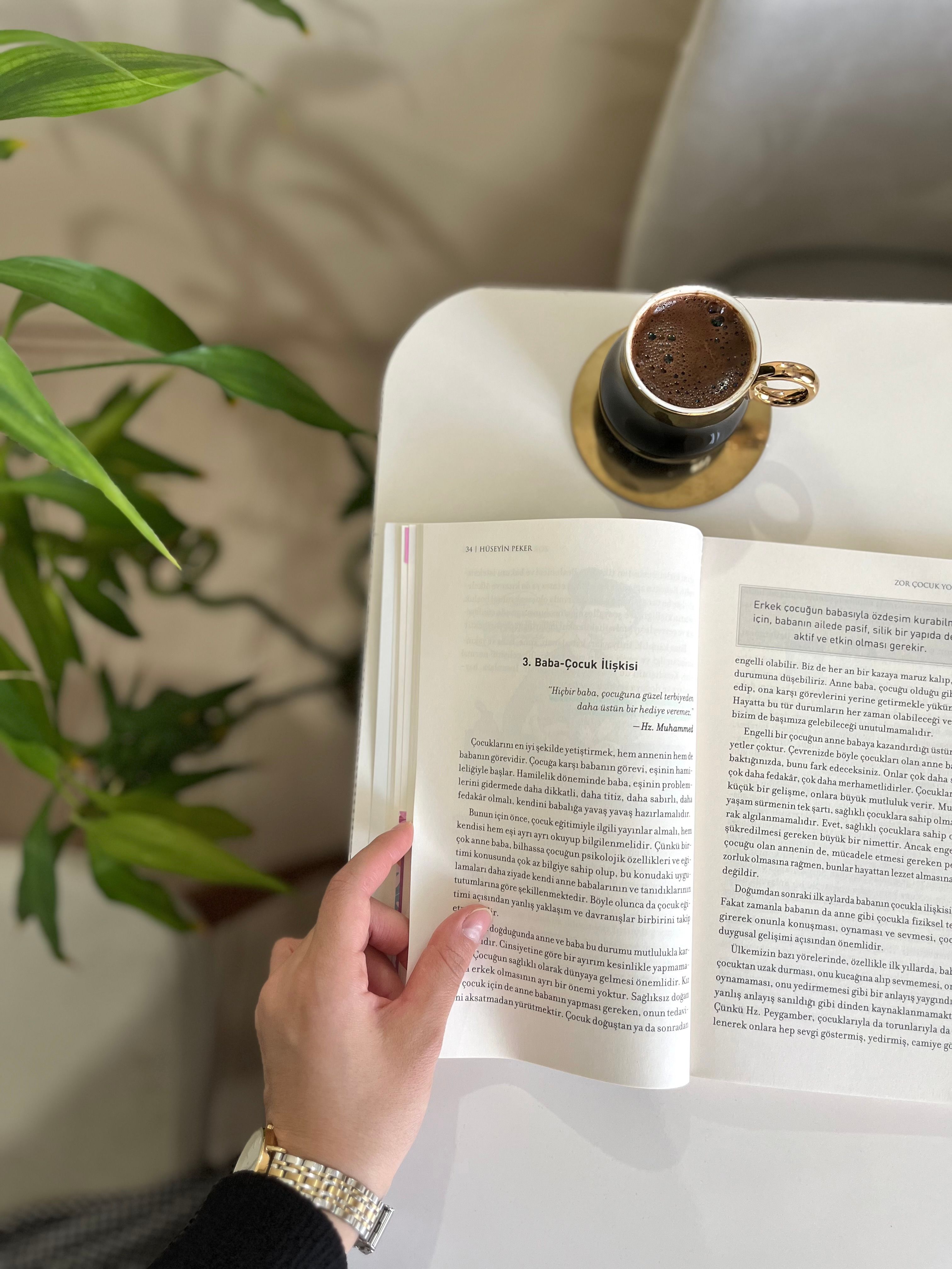 A relaxing moment with an open book and Turkish coffee on a sunny day.