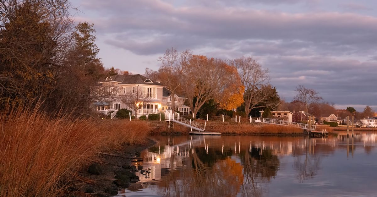 Beautiful autumn waterfront scene at dawn in Stamford, Connecticut, with vibrant fall colors and serene reflections.