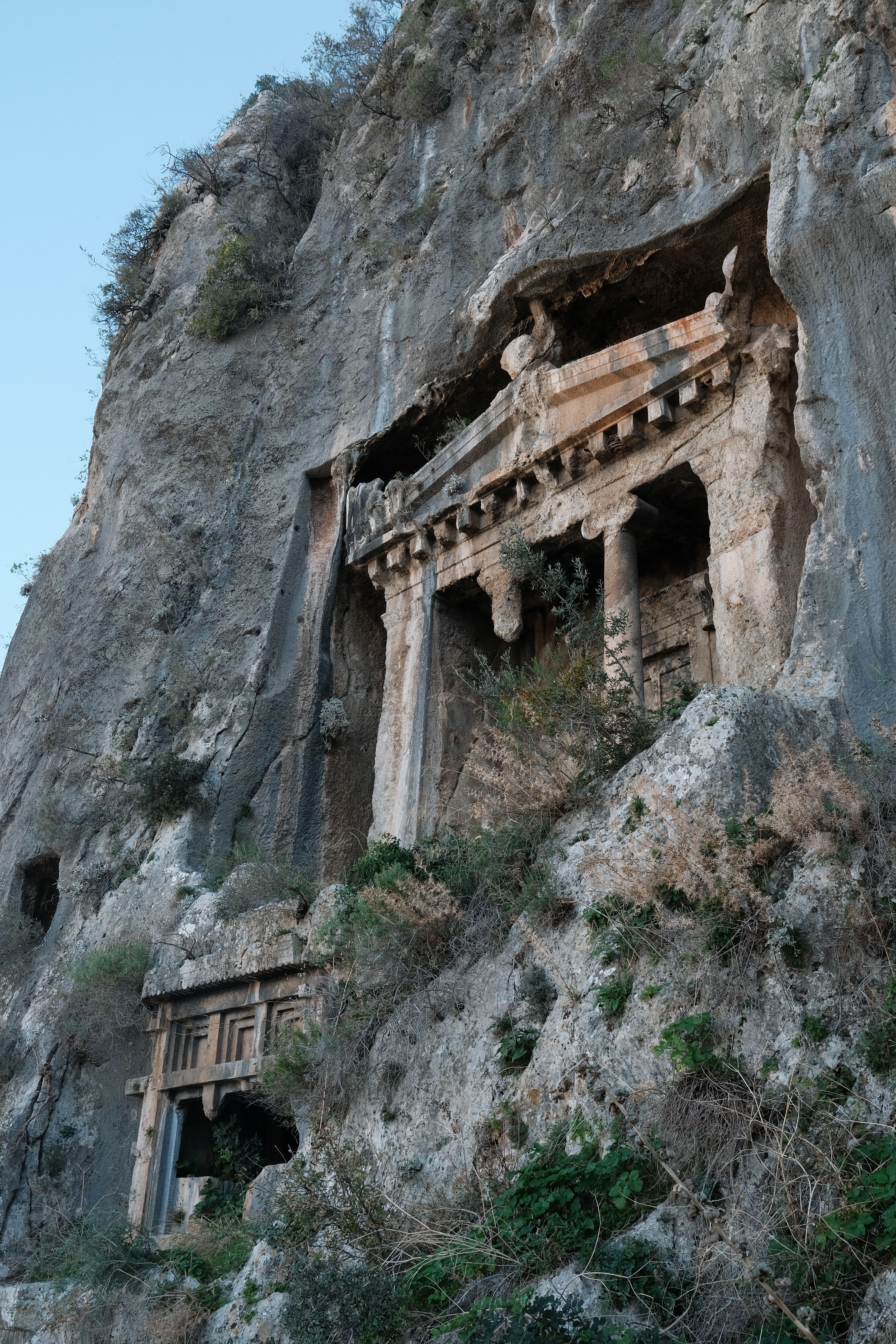 Ancient Rock-Cut Tombs in a Cliffside · Free Stock Photo