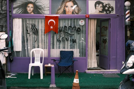 A vibrant barbershop in Istanbul with a Turkish flag and elegant window displays. Ideal for cultural and street photography.