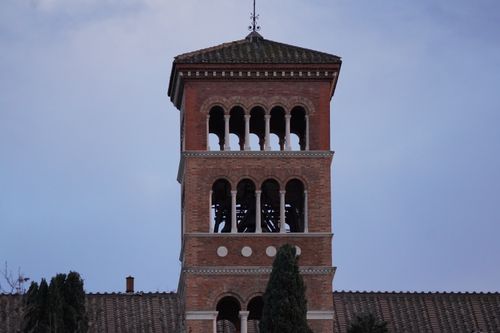 Free A classic Romanesque-style bell tower against a clear sky in Rome, Italy. Stock Photo