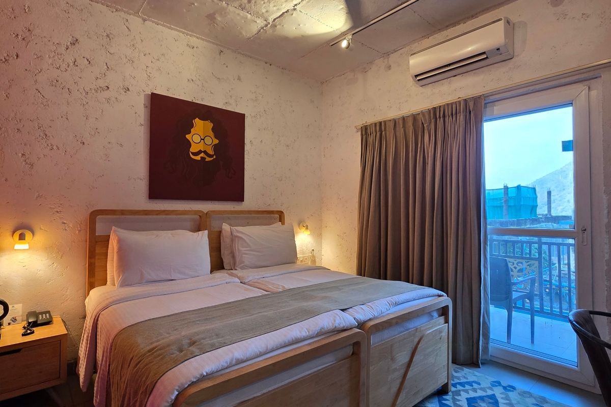 Twin bed hotel room prepared for guests