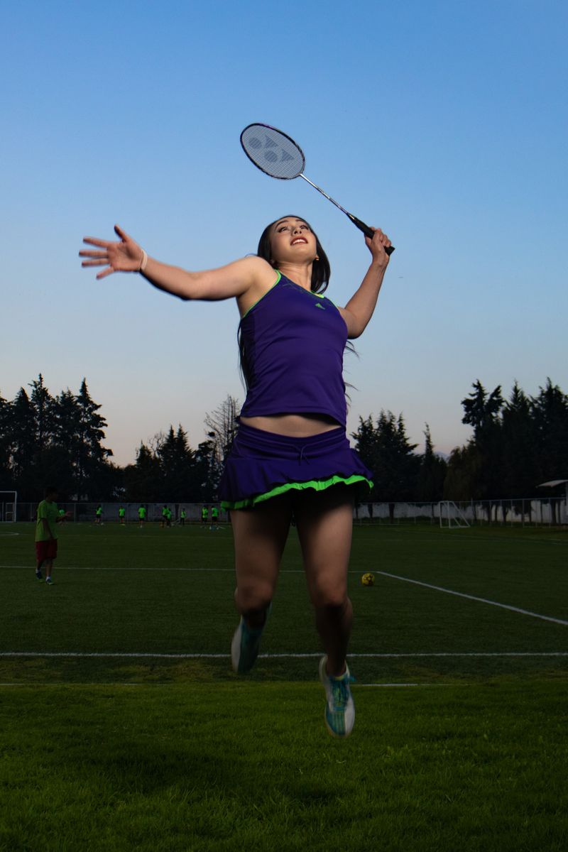Badminton player holding a racket before a serve