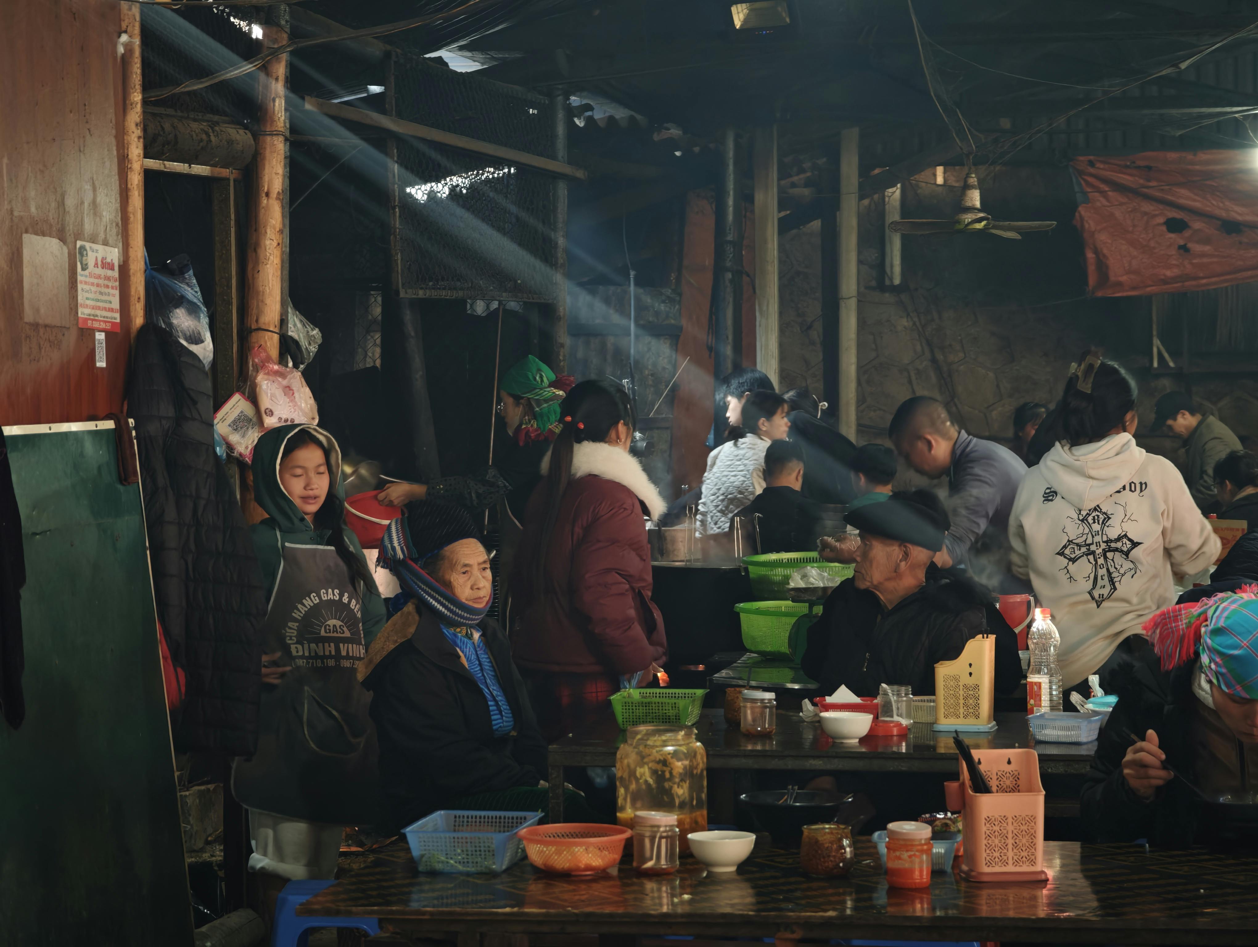local food market in Ho with people eating fufu