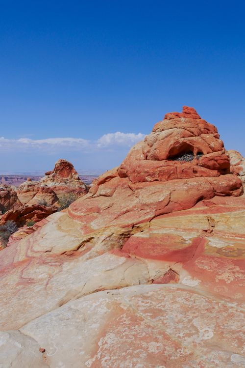 Free Explore breathtaking red rock formations in a remote desert landscape under a clear blue sky. Stock Photo