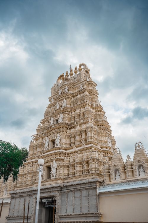 Free Ornate gopuram of a Hindu temple in Mysuru, India, highlighting traditional Dravidian architecture. Stock Photo