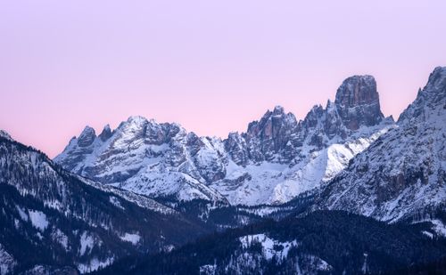Free Breathtaking view of the snow-capped Dolomites at sunset with a vibrant pink sky. Stock Photo