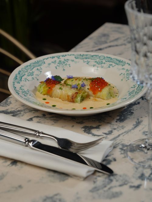 Free Gourmet stuffed cannelloni with caviar on a stylish table setting. Stock Photo