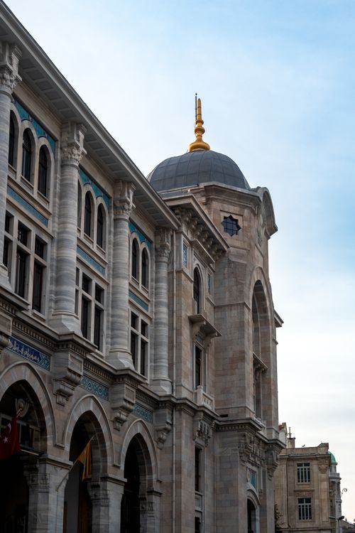 Free Elegant Ottoman-style building facade with domes and arches illustrating Istanbul's rich architectural heritage. Stock Photo