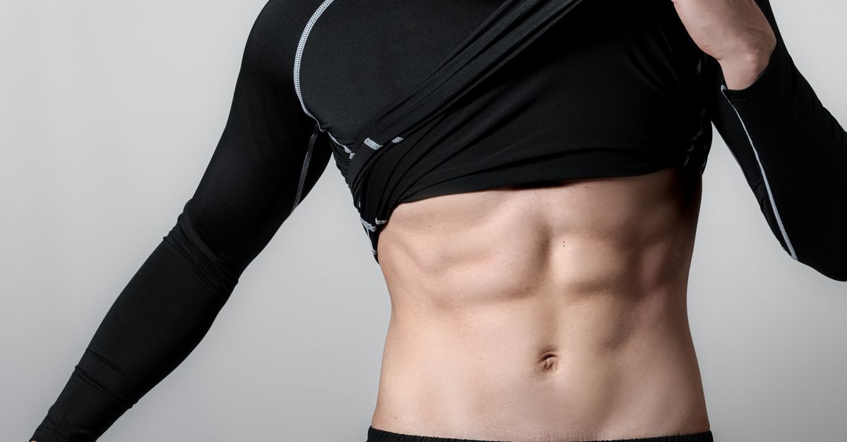 Athlete Showing Defined Abs In Black Sportswear Free Stock Photo athlete-showing-defined-abs-in-black-sportswear-free-stock-photo