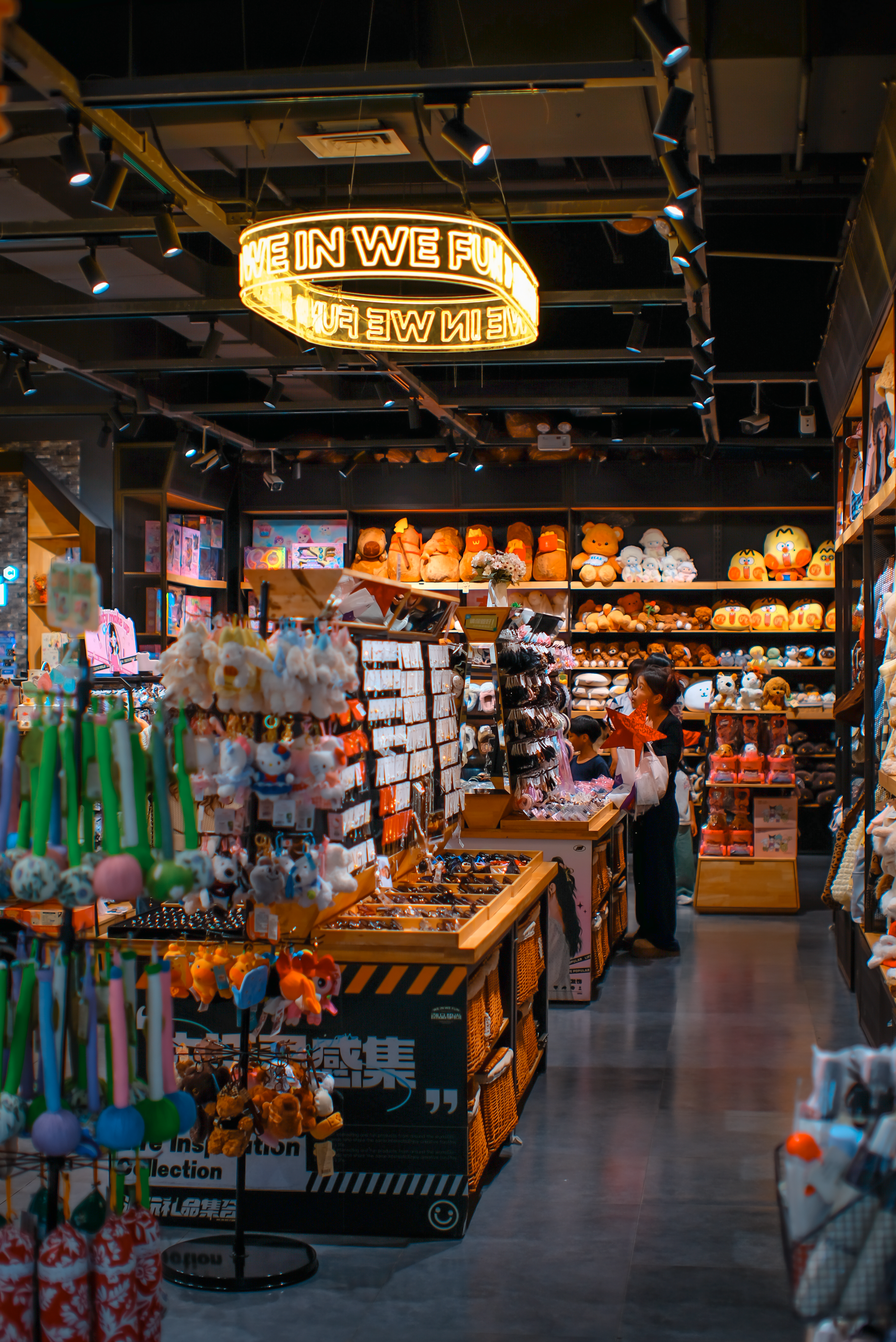 Vibrant toy store showcases plush toys, colorful trinkets, and creative displays under warm lighting.