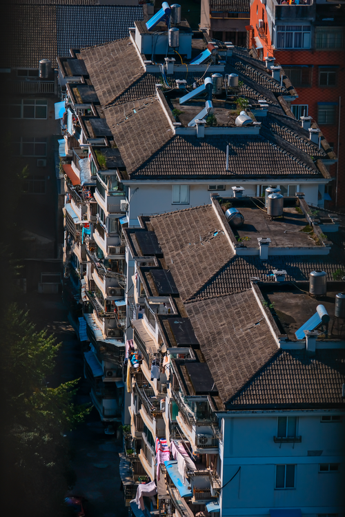 Free Bird's-eye view of closely packed urban apartment buildings. Stock Photo