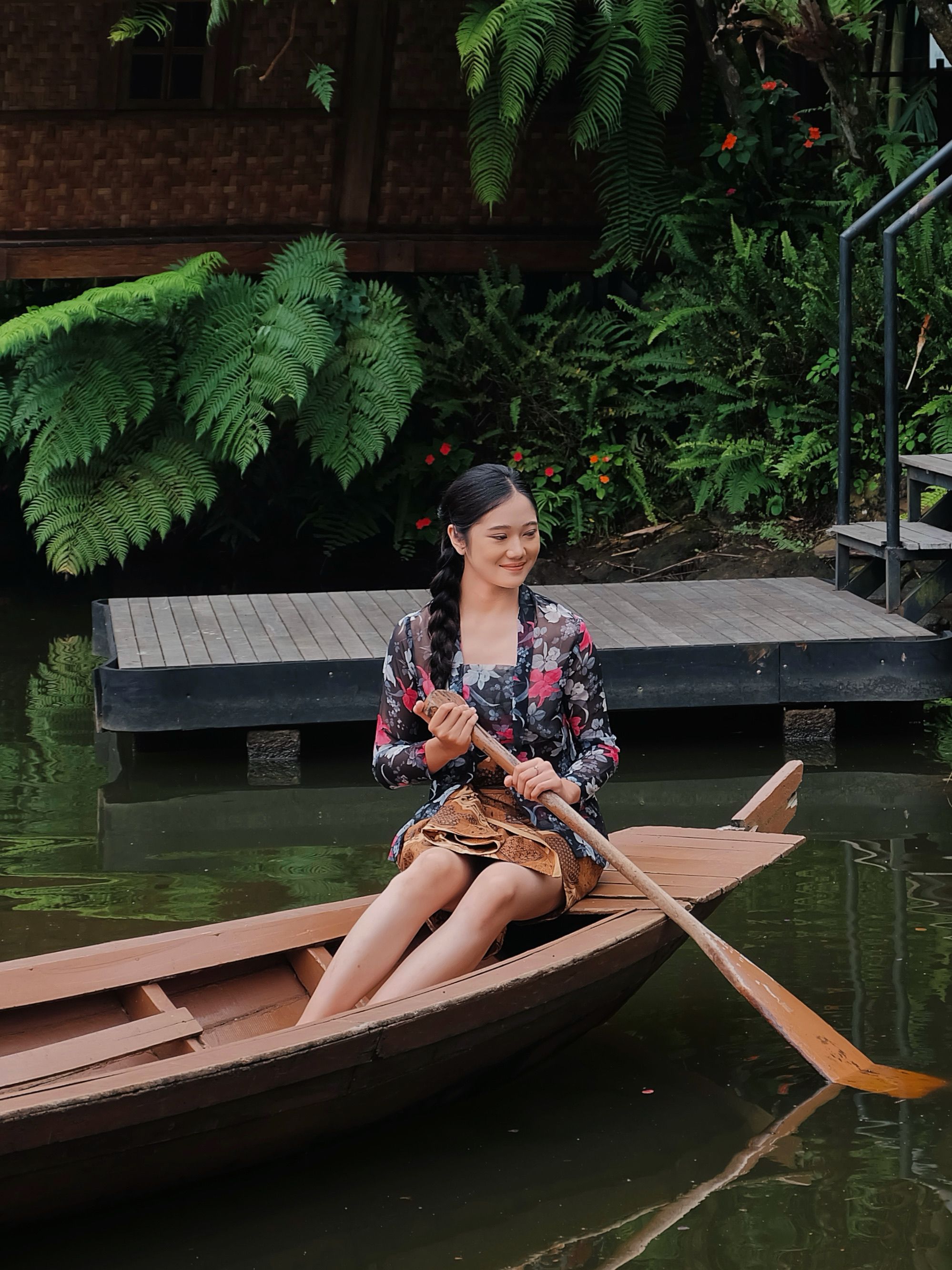 Woman Rowing a Boat in Tropical Setting · Free Stock Photo