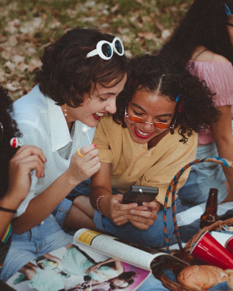 Shallow Focus Photo Of Woman Using Game Boy