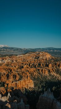 A breathtaking view of Bryce Canyon's unique red rock formations in Utah, captured on a sunny day.