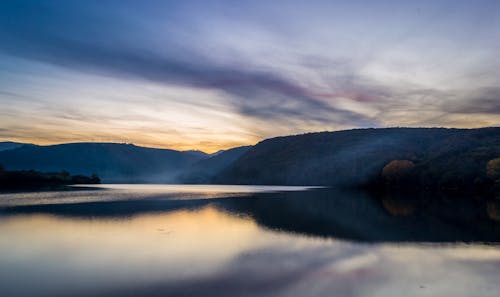 Body of Water Near Mountains