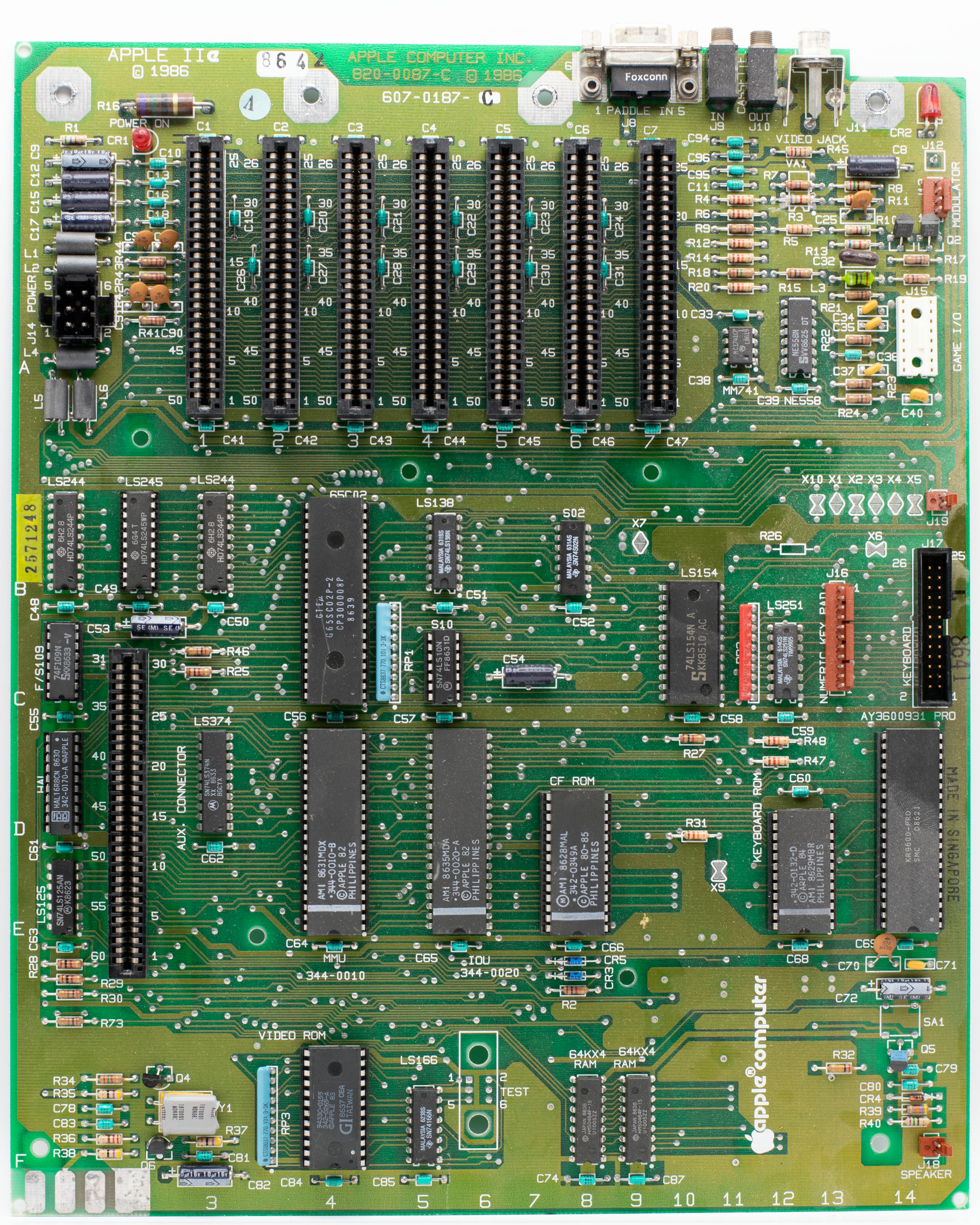 Close-up of a vintage Apple II motherboard showcasing circuits and components.
