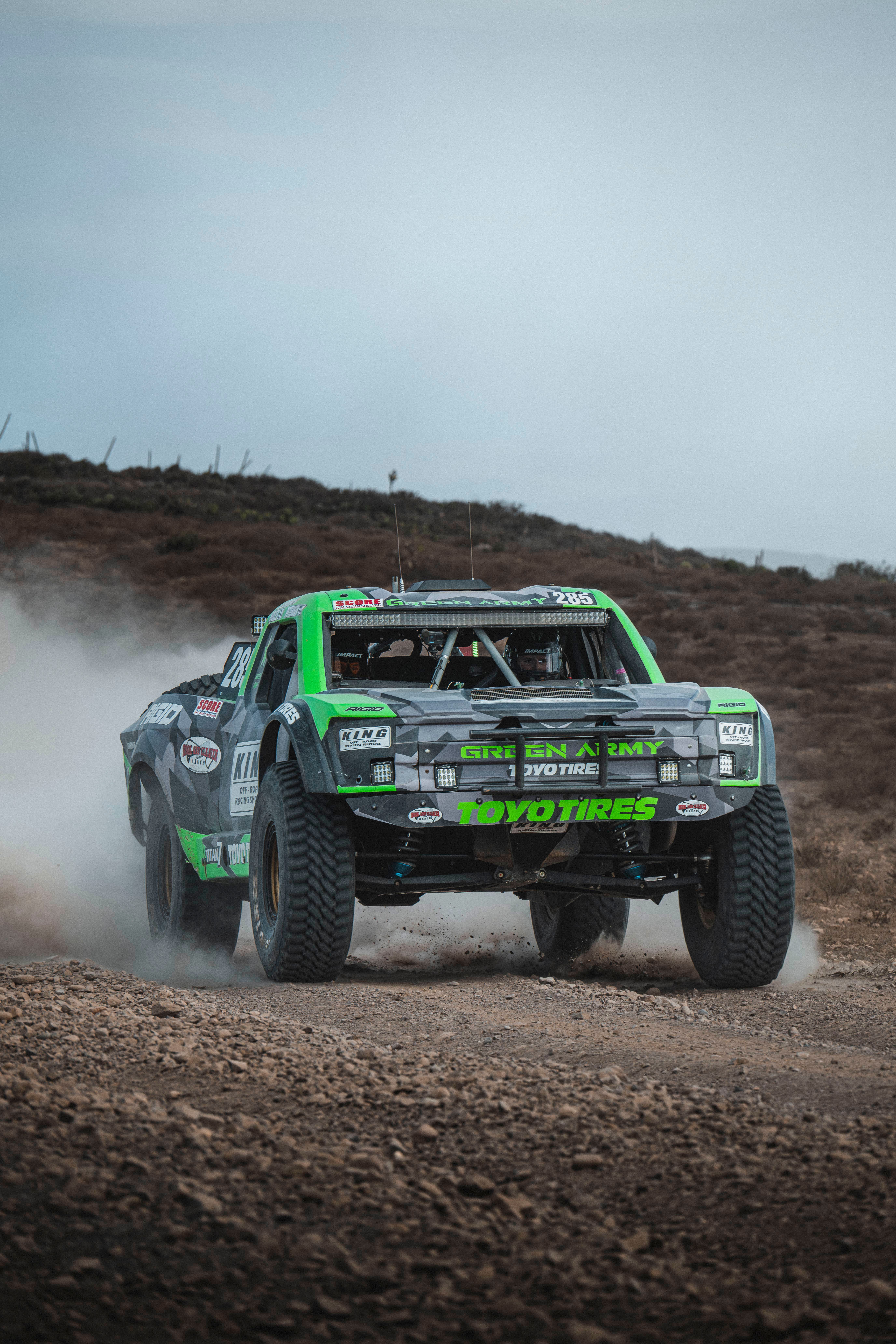 Powerful off-road truck racing across the Baja California desert landscape for an exciting motorsport event.