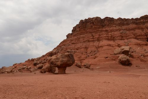 Free Explore the majestic red rock formations and arid desert landscape under a cloudy sky. Stock Photo